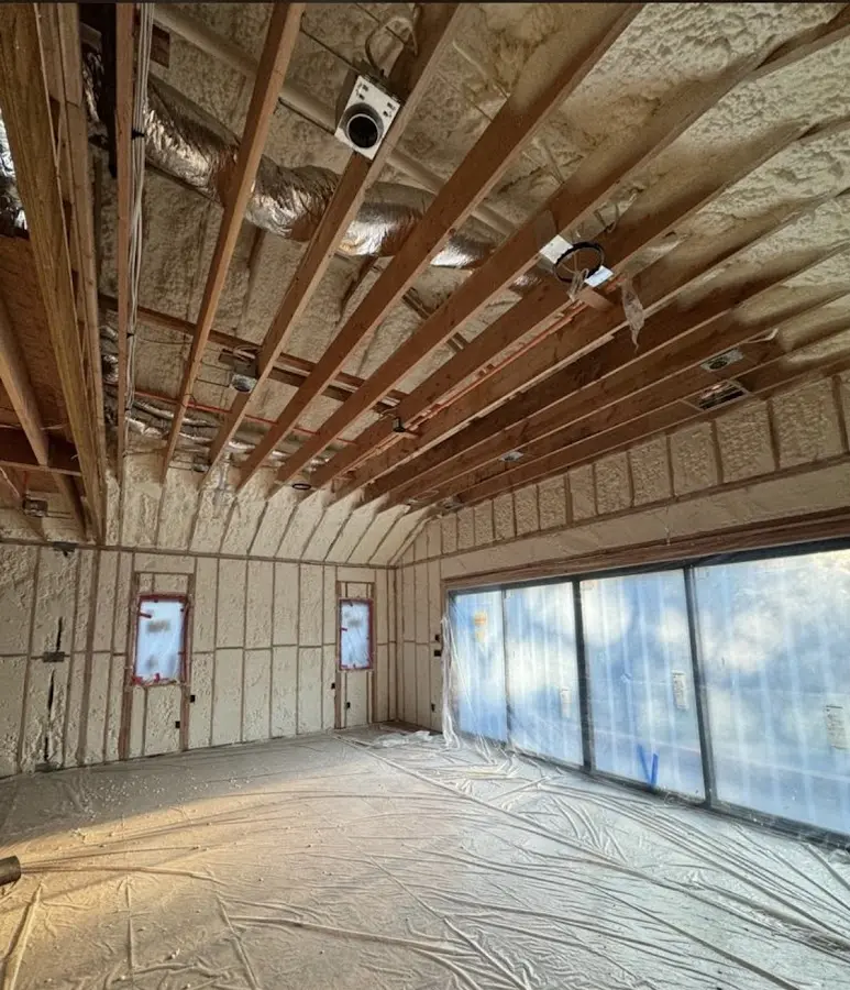Interior walls and ceiling insulated with spray foam during new construction in Roxborough Park